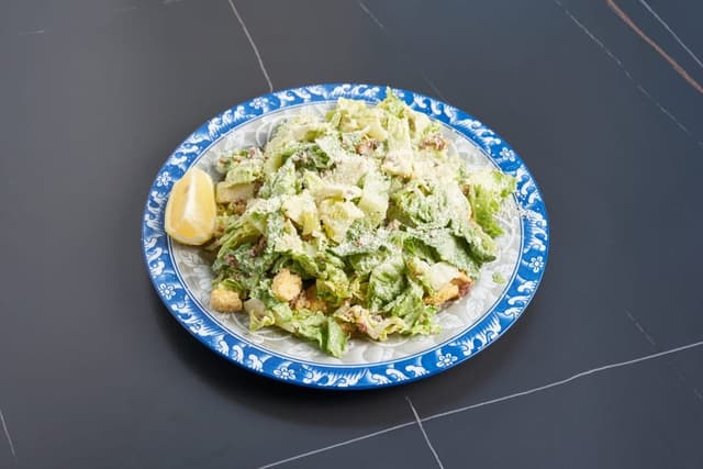 Caesar Salad prepared by Greek Mansion