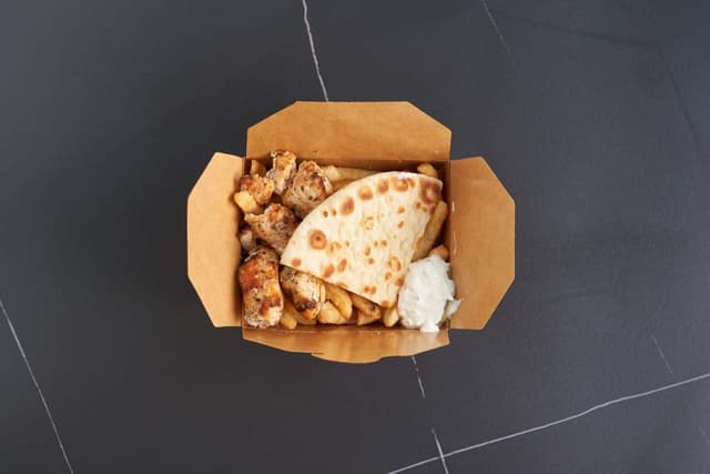 Chicken on Fries prepared by Greek Mansion